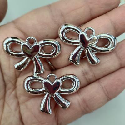 0.43元一个/整包卖 24*35mm镀银色吊孔爱心蝴蝶结 DIY手工串珠挂件项链耳环饰品配件